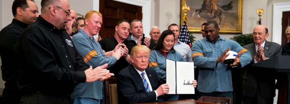 US President Donald Trump signed an order imposing stiff and sweeping new tariffs at the White House on March 8.