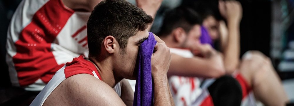 Iran basketball team members after the loss to New Zealand