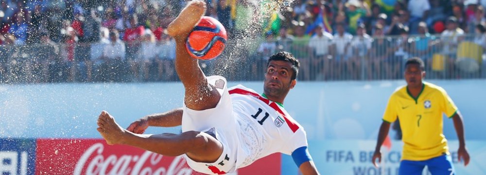 Mohammad Ahmadzadeh scores a goal with a bicycle kick during the FIFA Beach Soccer World Cup Portugal 2015 Group C match between Iran and Brazil.