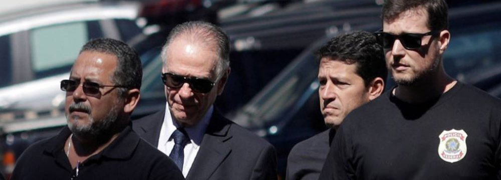 Brazilian Olympic Committee (COB) President Carlos Arthur Nuzman (2nd L) arrives to Federal Police headquarters in Rio de Janeiro, October 5.