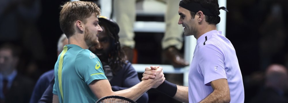 David Goffin (L) and Roger Federer