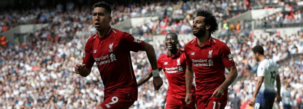 Firmino’s (L) absence would be a big blow to last season’s Champions League finalist.