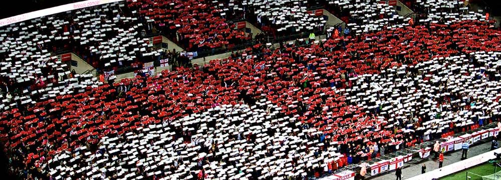 England fans shaping the flag with mosaics.