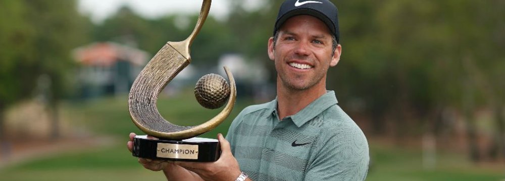 Paul Casey poses with the trophy after winning the Valspar Championship golf tournament  at Innisbrook Resort.