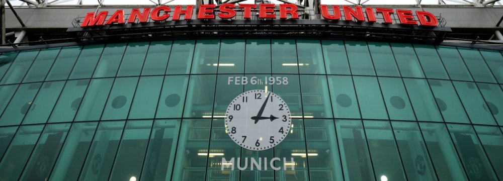 The clock on the wall of Old Trafford set to the time of incident.