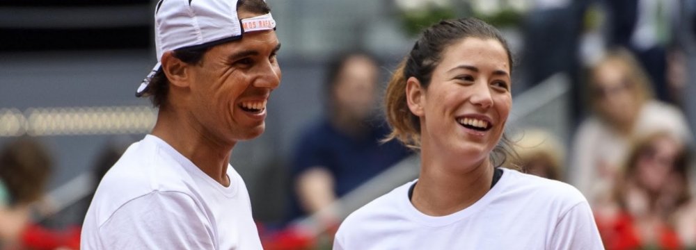 Rafael Nadal (L) and Garbine Muguruza