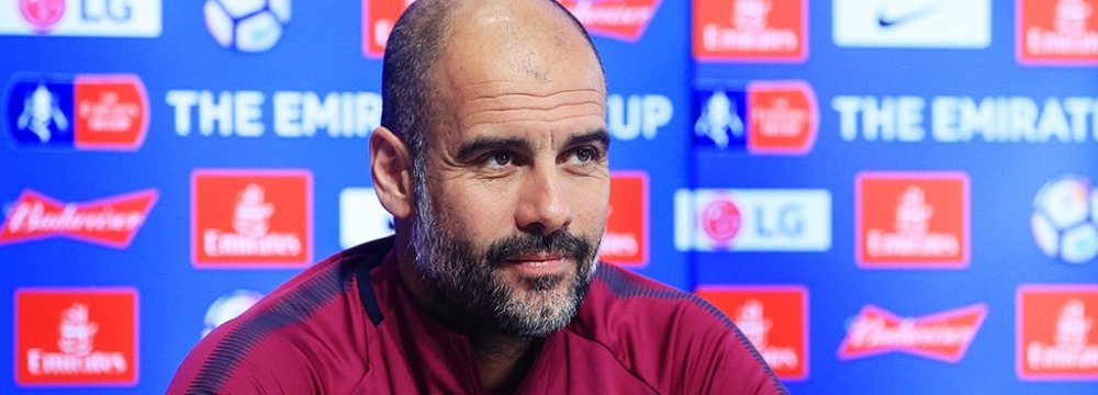 Pep Guardiola Charged for  Wearing Pro-Catalan Ribbon