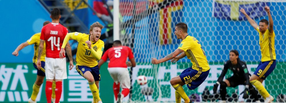 Sweden’s Emil Forsberg (No. 10) celebrates scoring his side’s only goal against Switzerland.
