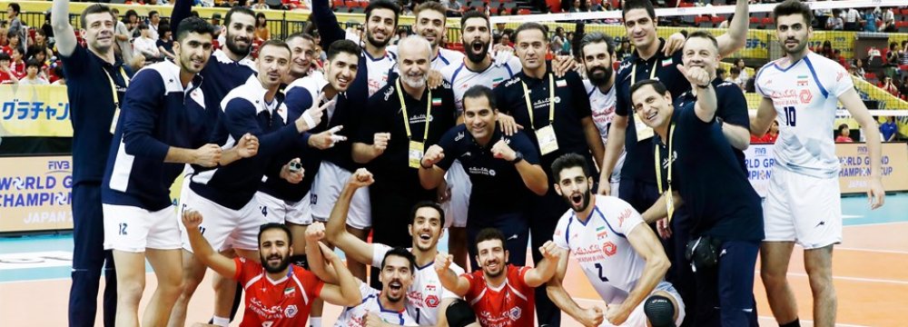Iran players and coaching team celebrate after the victory