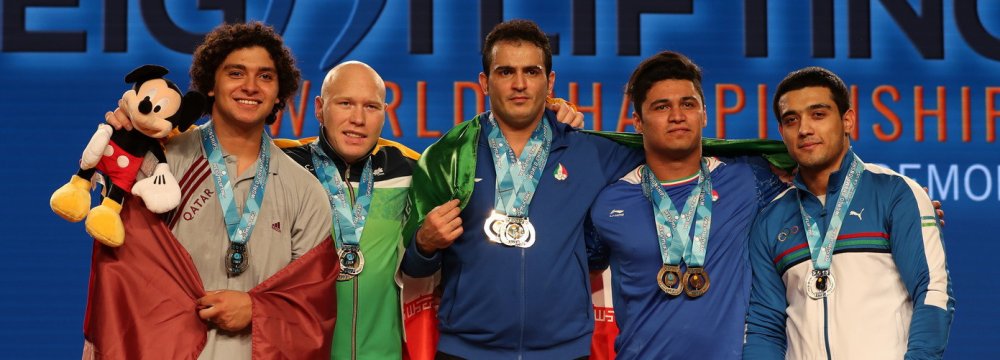 Sohrab Moradi (C) won three gold medals and Seyyed Ayub Mousavi (second R) won two bronze medals in the 94kg division.