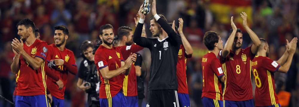 Spain players celebrate after the match with Albania.