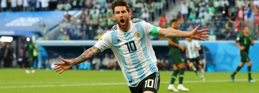 Lionel Messi celebrates scoring his teams’s first goal against Nigeria.