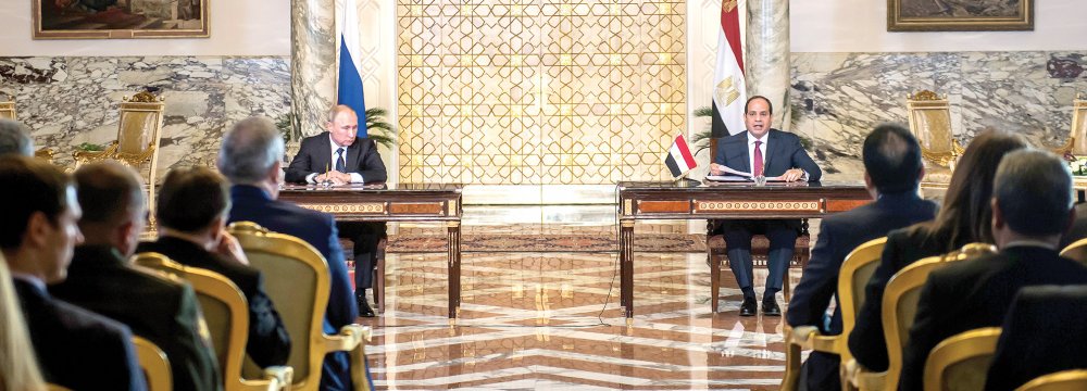 Egyptian President Abdel Fattah al-Sisi and his Russian counterpart Vladimir Putin (L) give a press conference following their talks at the presidential palace in Cairo on Dec. 11.