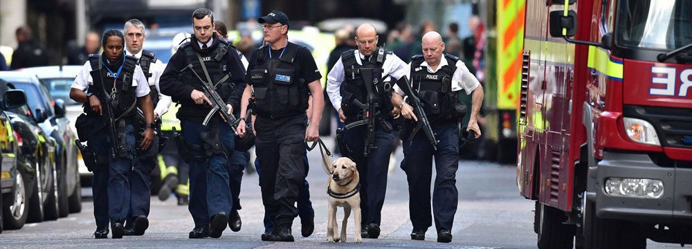 A group of police officers walk in London streets, on June 6, a few days after a terror attack on London Bridge and at Borough Market that killed seven people.