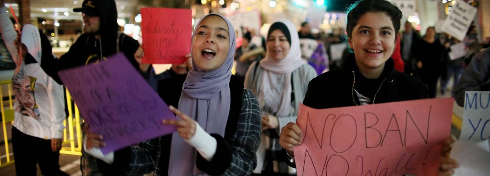 Revised Trump Travel Ban Suffers 1st Legal Blow