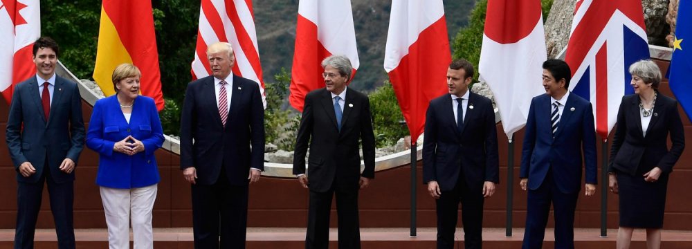 (L-R) Canada’s Trudeau, Germany’s Merkel, Trump of the US, Italy’s Gentiloni, France’s Macron, Japan’s Abe and Britain’s May attend the G7 Summit in Sicily, Italy, on May 26.