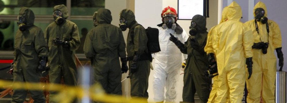 Hazmat crews at work in the main hall of Kuala Lumpur International Airport 2 in Sepang, Malaysia, on Feb. 26