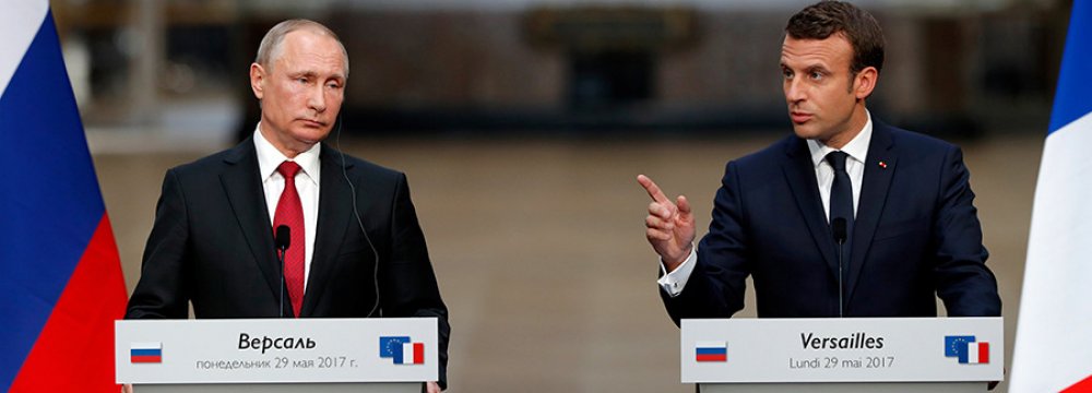Vladimir Putin (L) and Emmanuel Macron met at Versailles Palace,  near Paris, on May 29.