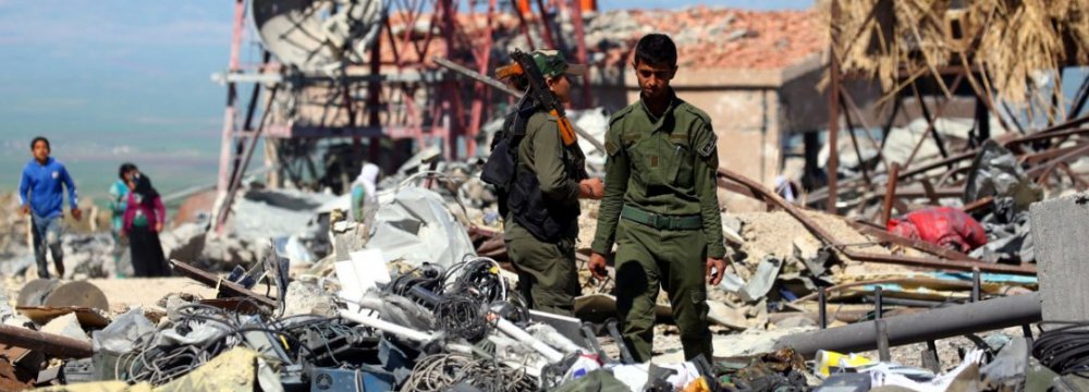 YPG forces at the site of Turkish airstrikes near the northeastern Syrian Kurdish town of Derik. 