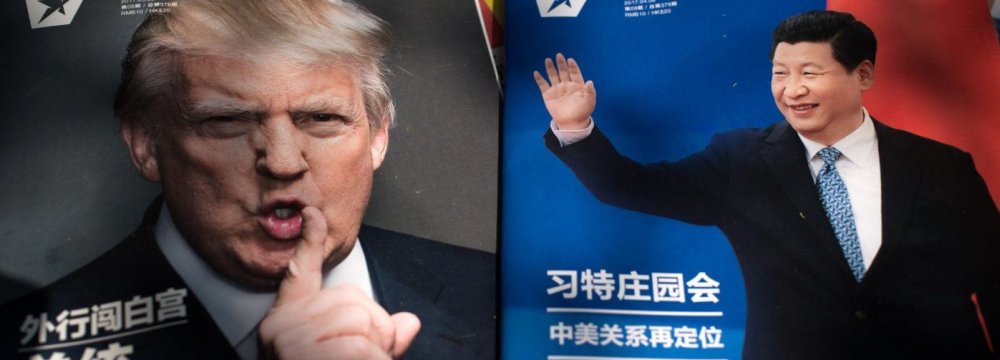 Chinese president Xi Jinping (R) and his US counterpart, Donald Trump, on magazine covers in China