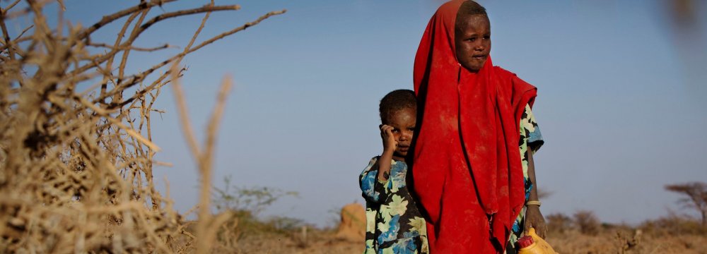 Six-year-old Tirig with her sister Saua in Burao, Somalia (File Photo)