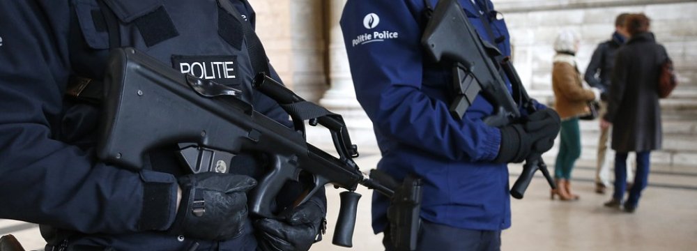 Belgian police officers guard a public building in Brussels.