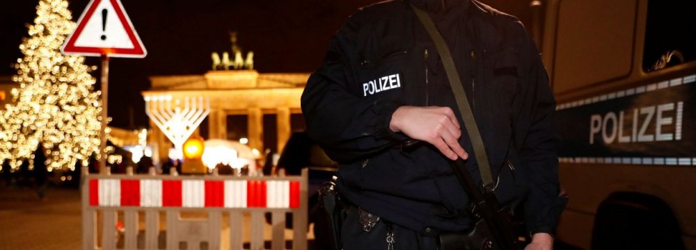 German police provide security at the Brandenburg Gate, ahead of the upcoming New Year’s Eve celebrations in Berlin, Germany, on Dec 27.