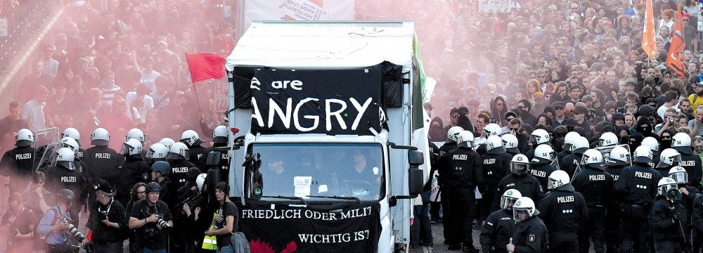 Riot police block the “Welcome to Hell” rally against the G20 summit in Hamburg, northern Germany on July 7.