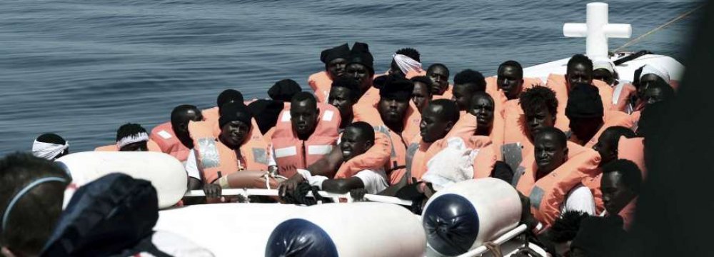 Migrants are rescued by staff members of the MV Aquarius in the central Mediterranean Sea on June 10.