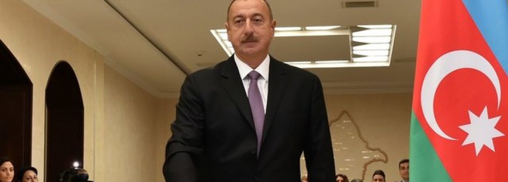 Ilham Aliyev casts his vote during a referendum on extending presidential terms in Baku in September 2016.