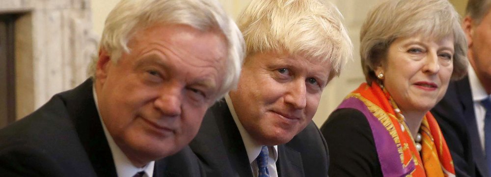 (From R-L) British Premier Theresa May, Boris Johnson and David Davis (File Photo) 