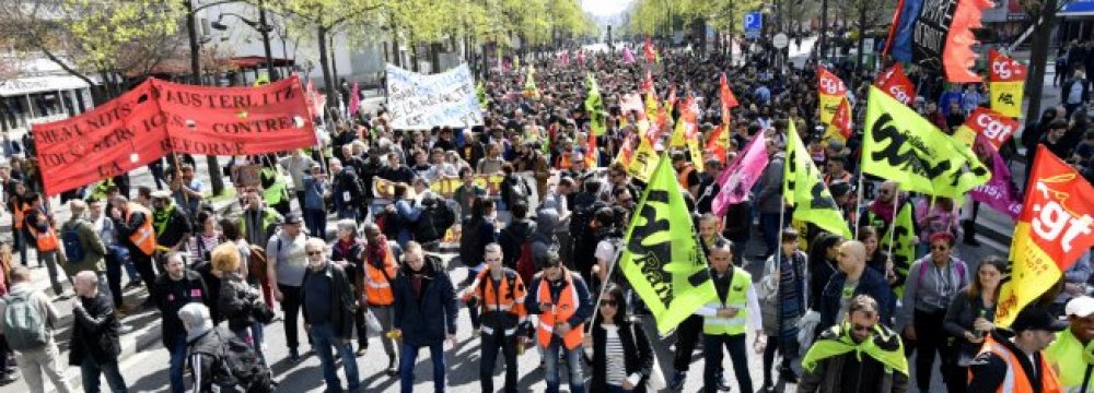 Public railways SNCF workers demonstrate against planned reforms of the French government on April 13 in Paris.