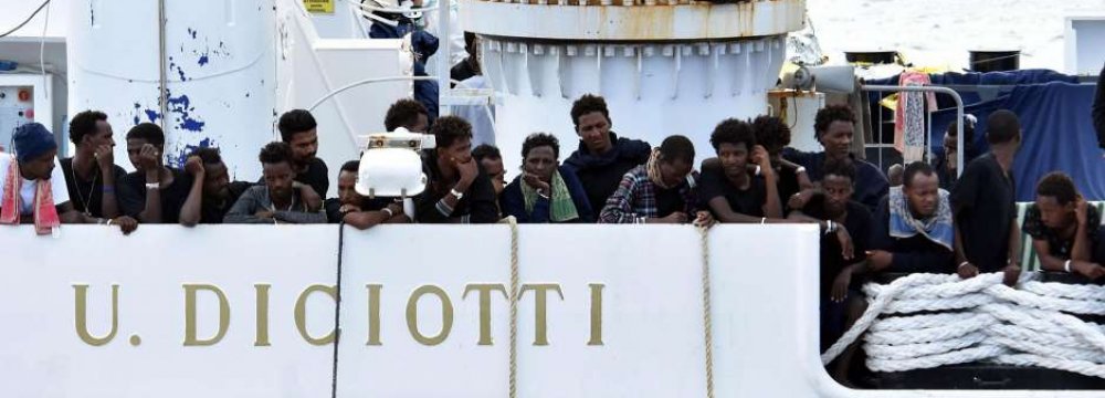 Migrants Disembark After Standoff as Italy’s Salvini Faces Probe