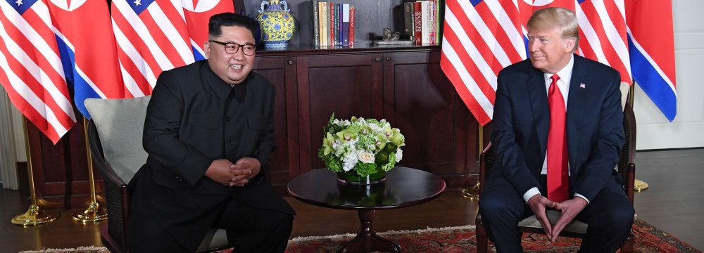 US President Donald Trump (R) and North Korean leader Kim Jong-un in Singapore on June 12