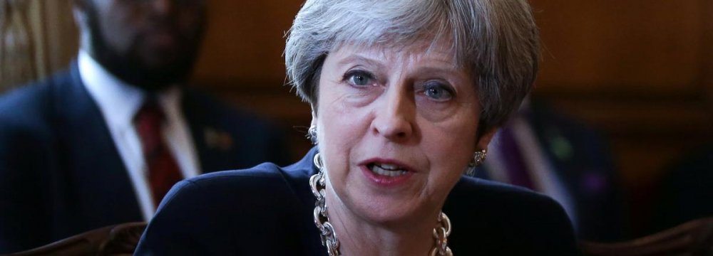 May Apologizes to Caribbean States on UK Treatment of Post-War Migrants