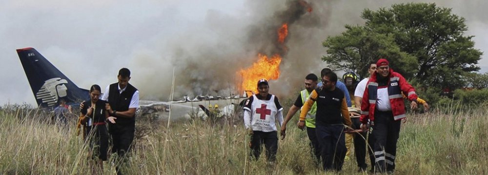 Passengers, Crew Flee  to Safety Before Crashed Plane Explodes