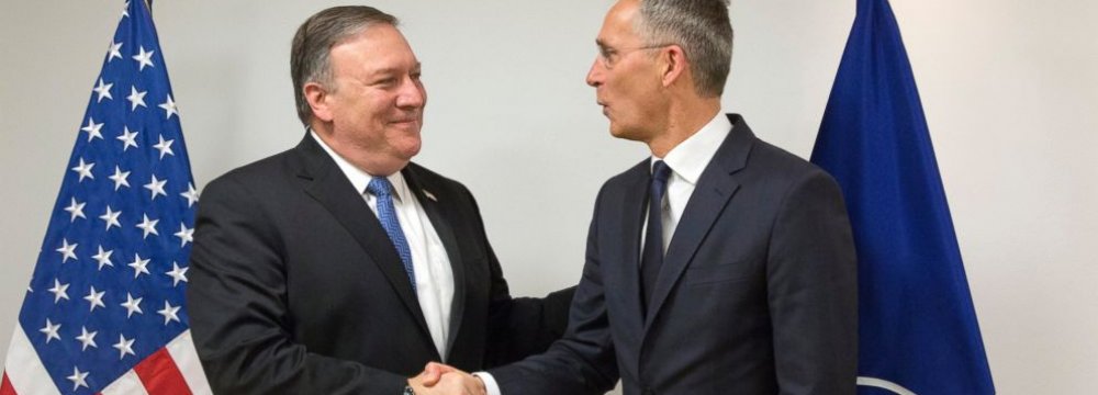 US Secretary of State Mike Pompeo (L) shakes hands with NATO Secretary General Jens Stoltenberg at NATO headquarters in Brussels on April 27.