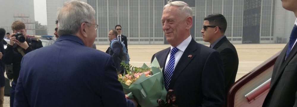 US Defense Secretary Jim Mattis (C) arrives at Beijing Capital International Airport in Beijing on June 26.