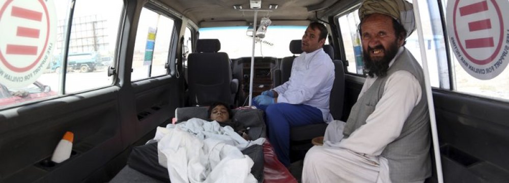 An injured boy rides in an ambulance on the Ghazni highway, in Maidan Shar, west of Kabul, Afghanistan, on August 13.