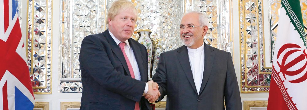 British Foreign Secretary Boris Johnson (L) meets Foreign Minister Mohammad Javad Zarif in Tehran on Dec. 9.