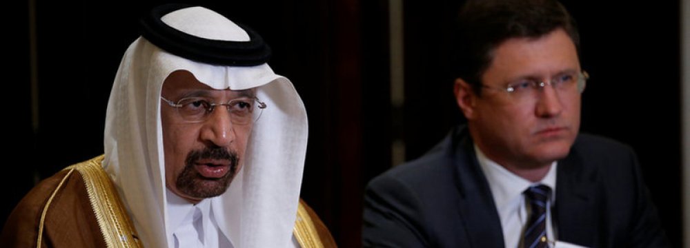 Saudi Arabia’s Energy Minister Khalid al-Falih (L) and Russia’s Energy Minister Alexander Novak attend a joint briefing in Beijing, 15 May.