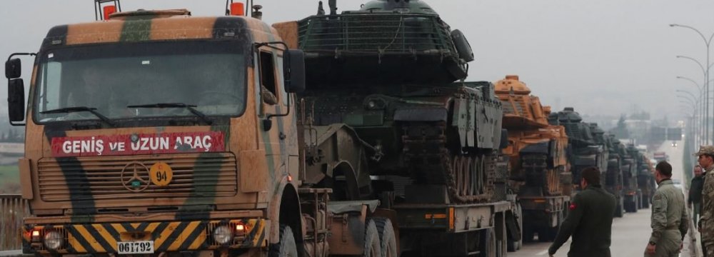 A Turkish military convoy arrives at an army base in the border town of Reyhanli near the Turkish-Syrian border in Hatay Province, Turkey.