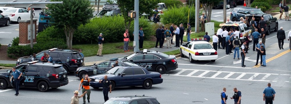 Maryland police officers blocking an intersection in Annapolis after employees were shot Thursday at the Capital Gazette office.