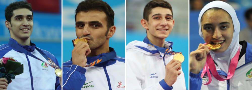 Mehdi Khodabakhshi (L), Masoud Hajizavareh (second L) and Farzan Ashourzadeh (second R) are among the world top 10 ranking of men taekwondokas in their respective weight categories and Kimia Alizadeh is fifteenth in the women’s list of -62 kg group.