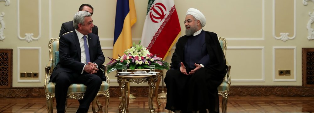 President Hassan Rouhani (R) meets his Armenian counterpart, Serzh Sargsyan, in Tehran on August 6.