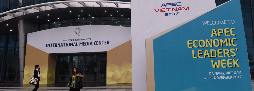 People walk outside the media center ahead of the APEC Summit in the central Vietnamese city of Danang on November 7.