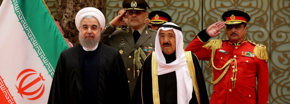 Kuwait’s Emir Sheikh Sabah al-Ahmad al-Sabah (R) receives President Hassan Rouhani who visited Kuwait City on Feb. 15 after a short trip to Oman. 