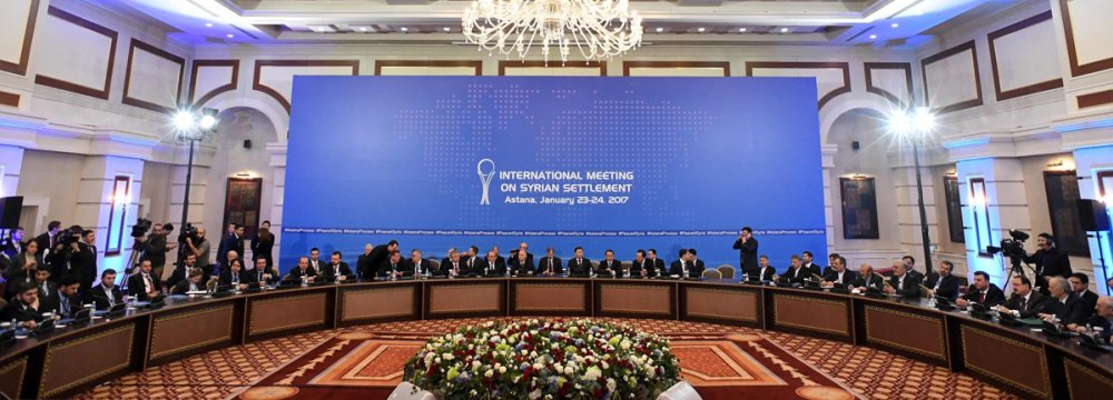 Delegations from Russia, Iran and Turkey hold talks on Syrian peace in the Kazakh capital of Astana on Jan. 23.
