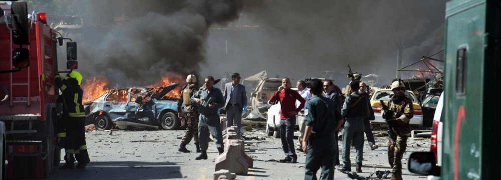 Afghan security forces arrive at the site of a car bomb attack in Kabul on May 31.