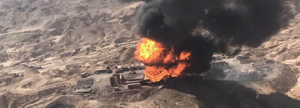 Iran: Battle to Put Out Burning Oil Well
